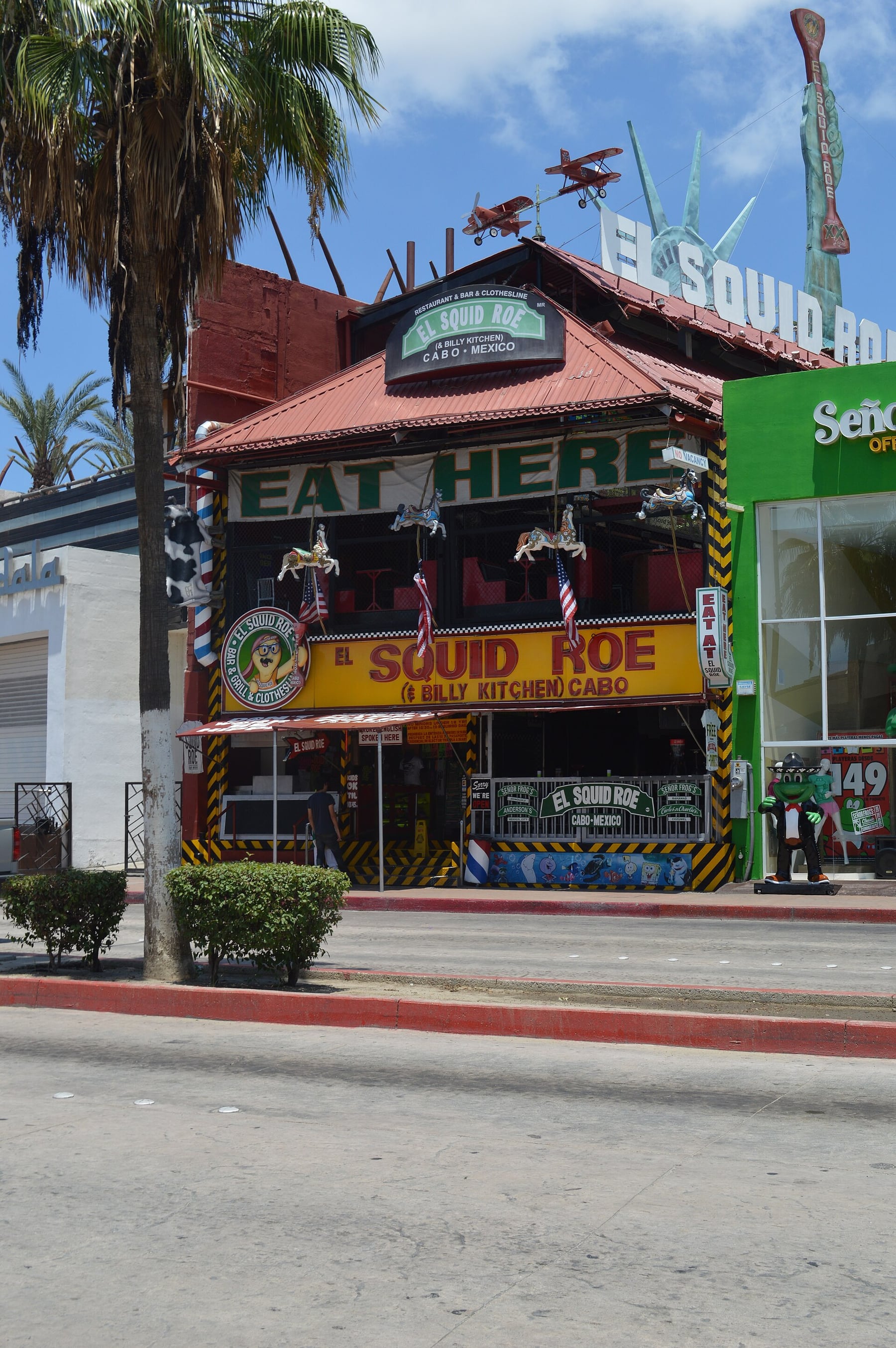 Colorful exterior facade of El Squid Roe in downtown Cabo San Lucas.